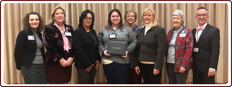 Jennifer Bever, Administrator; Sara Hamm, Sr. VP of Successful Aging and Health Services; Lynn Biot Gordon, COO, Katelyn Reichow, 2018 CNA of year; Joni M. Scott, Director of Nursing; Rhonda Brand, President; Margaret Good, Family Member and David Miller, Executive Director