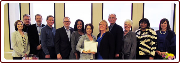 The Kansas Foundation for Medical Care, inc (l to r) Sarah Irsik-Good, CEO and President; Dr. Bob Cox; Dr. Brian Wolfe; Tom Hintz; Dr. Ryan Spaulding; Lynn Biot Gordon, COO and co-Founder of NCCDP; Brenda Groves, 2019