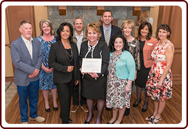 Lynn, Jennifer and Sandra (front center) with the staff from The Normandy Senior Living.  From left: David Orlean, President of The Orlean Company, Owner Normandy Senior Living Campus, Lori Presser, Co-President of NOAAP, Ken Lurie, Principal of the Orlean Company, Mathew Shula, Administrator of Normandy Care Center, Kelly Coury, Administrator for the Breakwater Apartments of Normandy Senior Living Campus, Kim Zdanowicz, Marketing Director of Normandy Senior Living, Tammy Danilovic, Education Chair of NOAAP & Activities Director of Normandy Care Center 